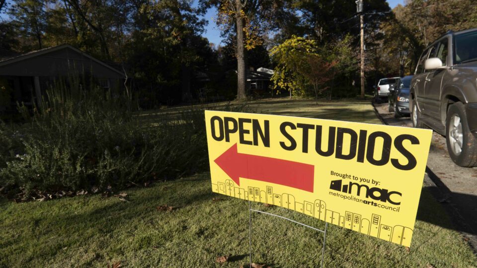 a yellow sign in a yard