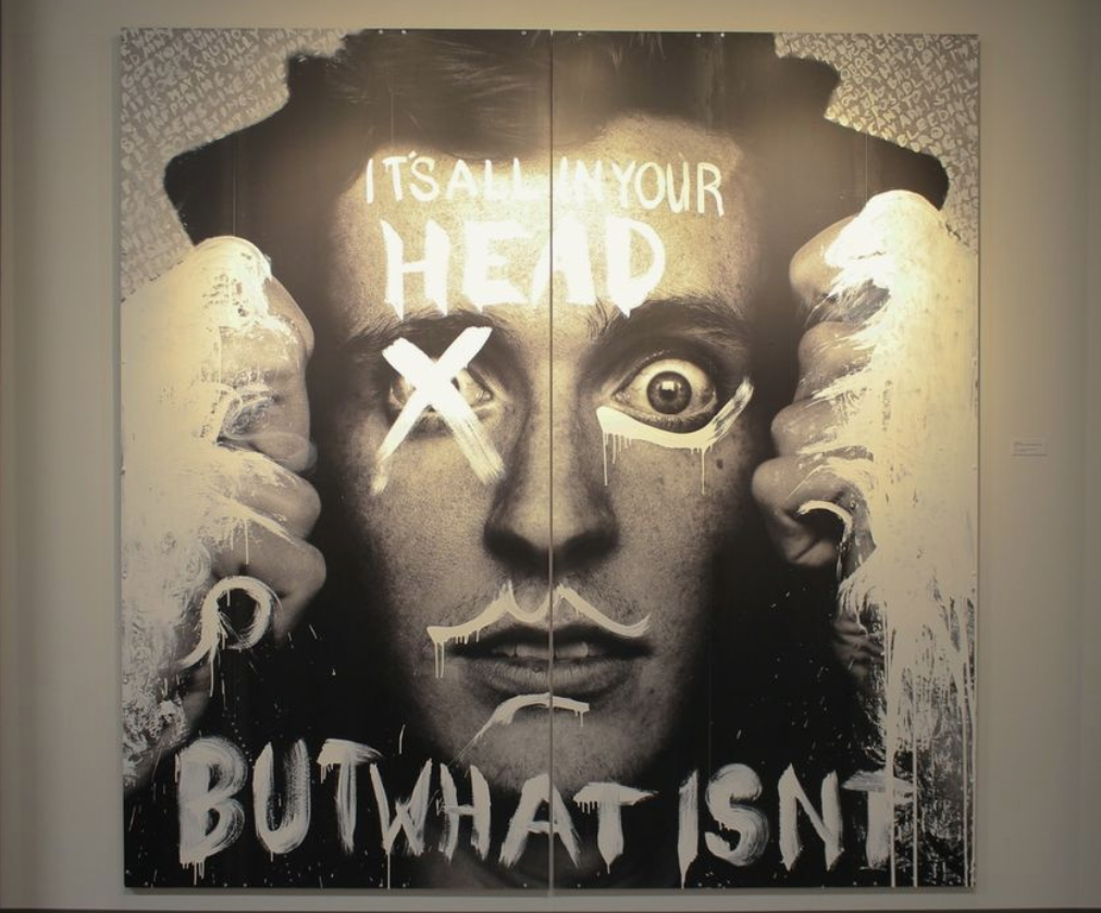a poster of a man with white paint on it
