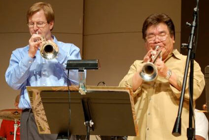 a couple of men playing instruments