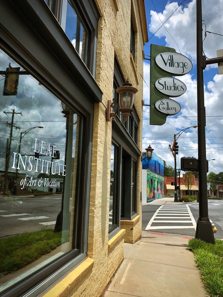 a street corner with a sign on the side