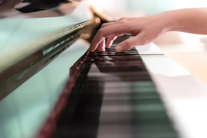 a person playing a piano