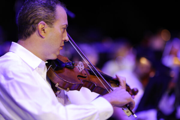 a man playing a violin