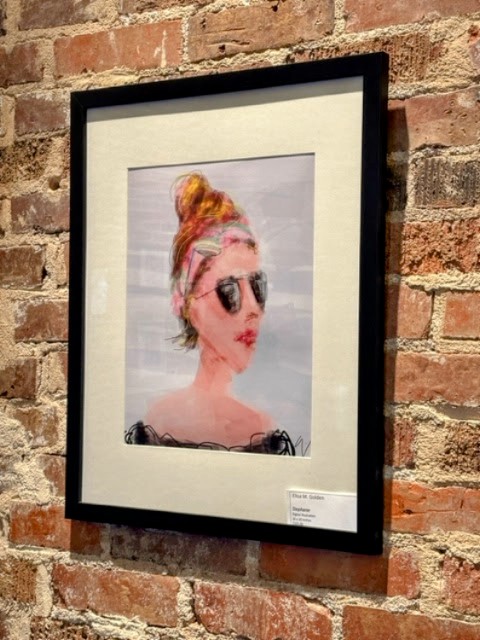 a framed picture of a woman