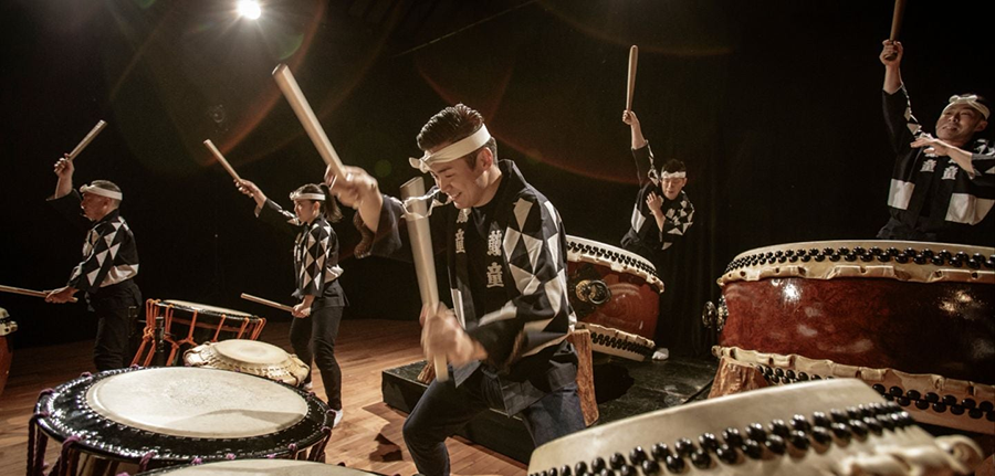 a group of people playing drums