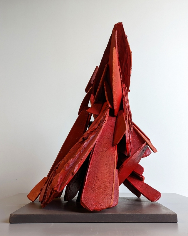 a red sculpture on a table