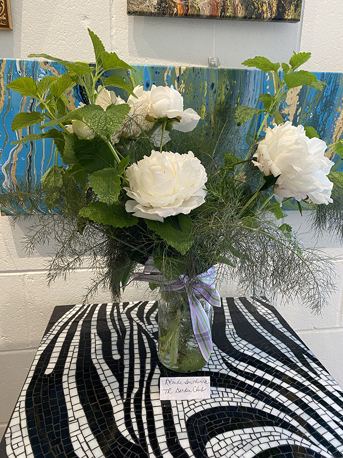 a vase of white flowers