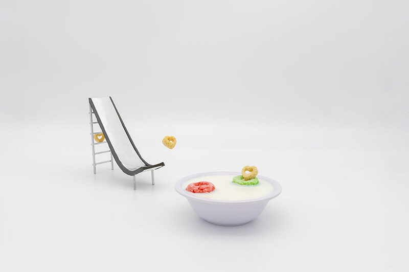 a toy slide and bowl of cereal