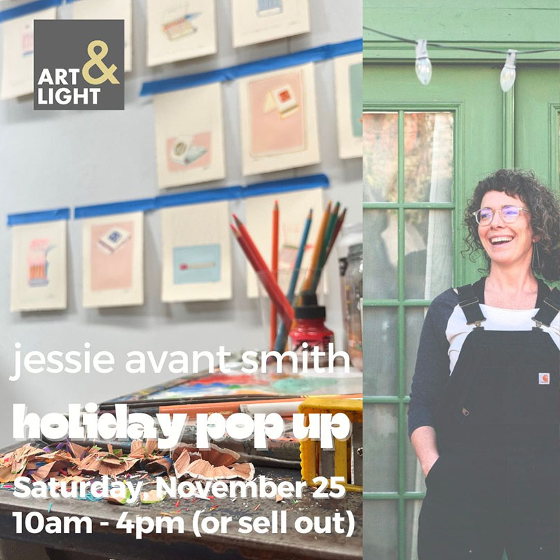 a woman standing in front of a table with art supplies