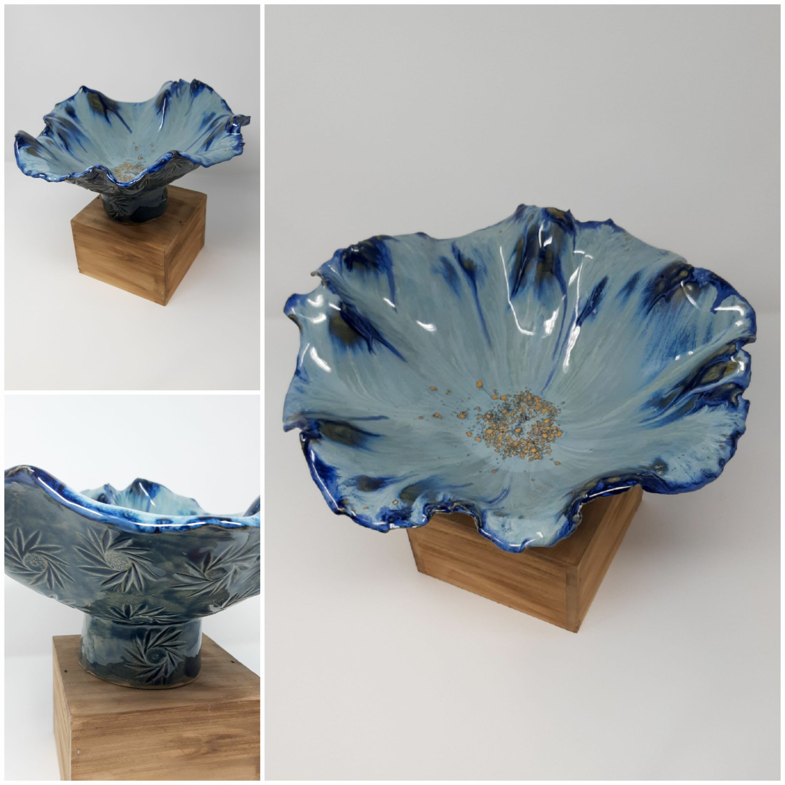 a blue and white bowl on a wood stand