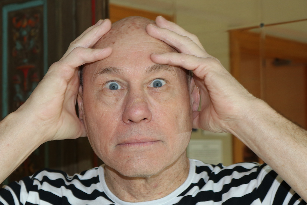 a man holding his head