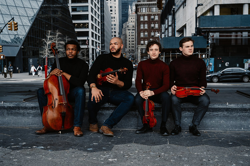 a group of men holding instruments