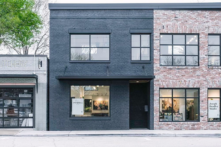 a building with windows and a tree