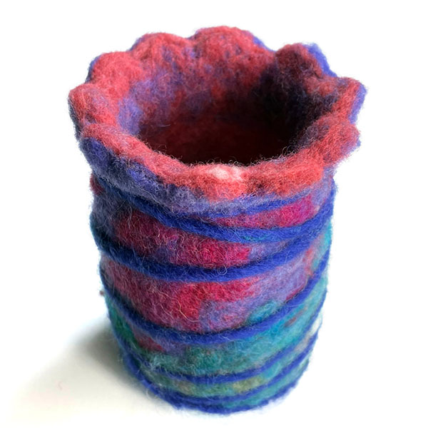 a colorful felted cup