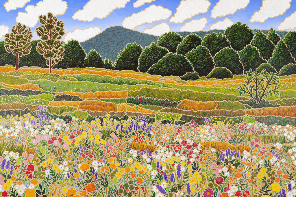a field of flowers and trees