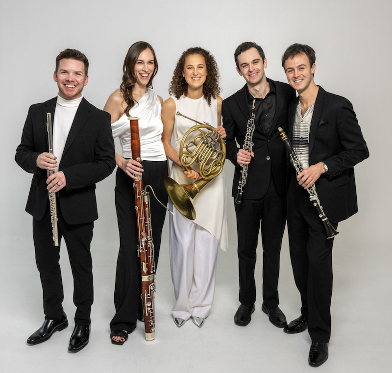 a group of people holding musical instruments