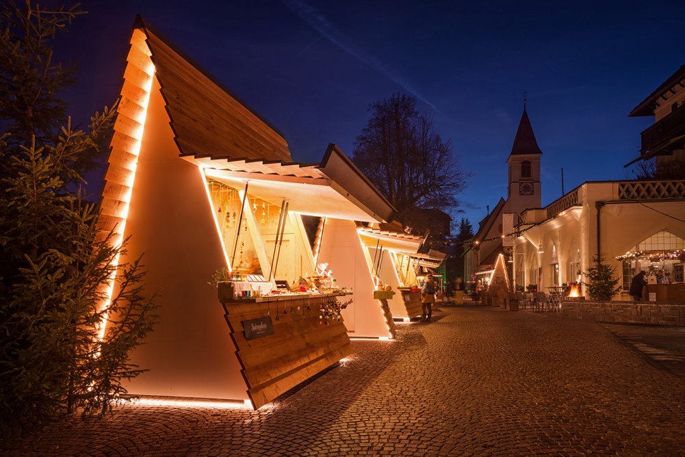 a small buildings with lights on