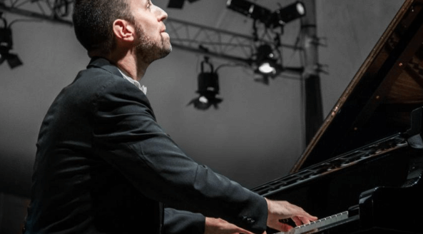 a man playing a piano