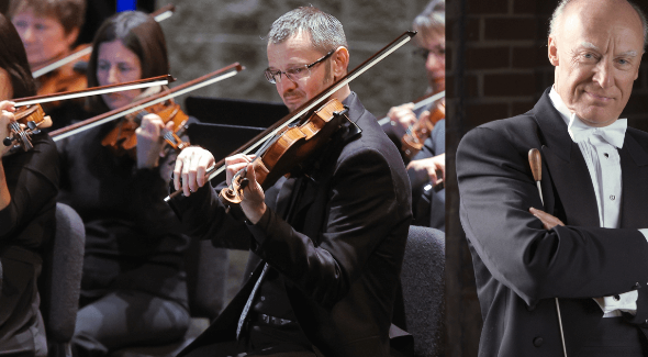 a man playing a violin