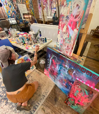 a person painting on the floor