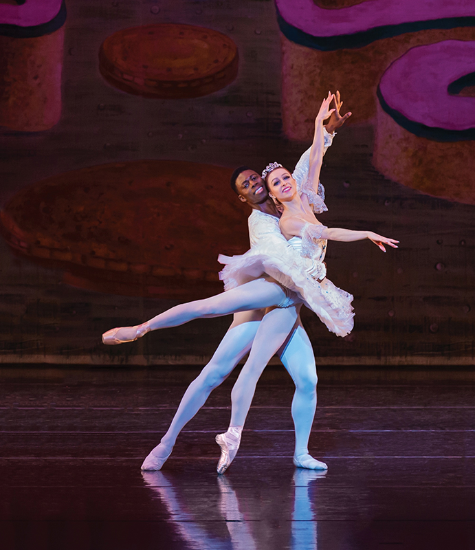 a man and woman dancing on a stage