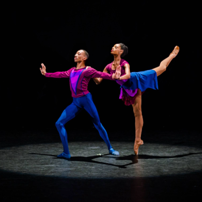 a couple of dancers on a stage