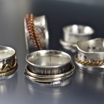 a group of silver rings