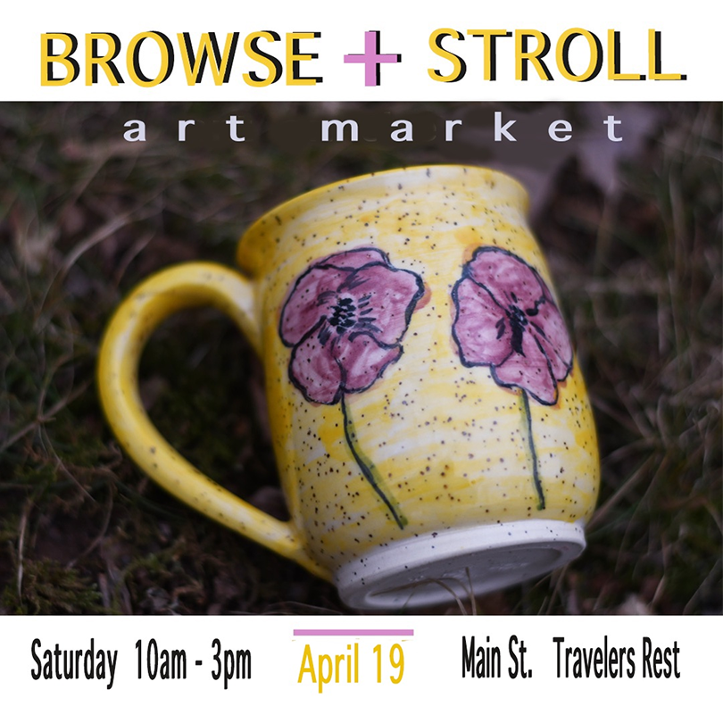 a yellow mug with flowers on it
