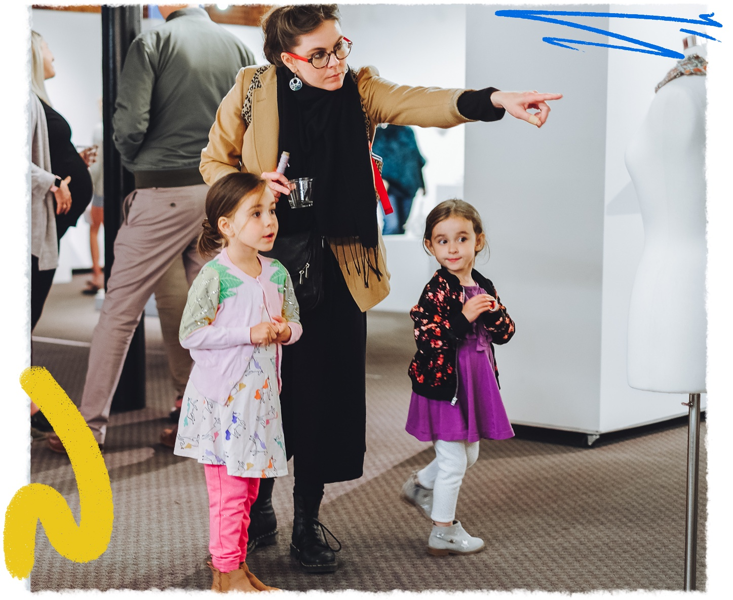 a woman pointing at a group of children