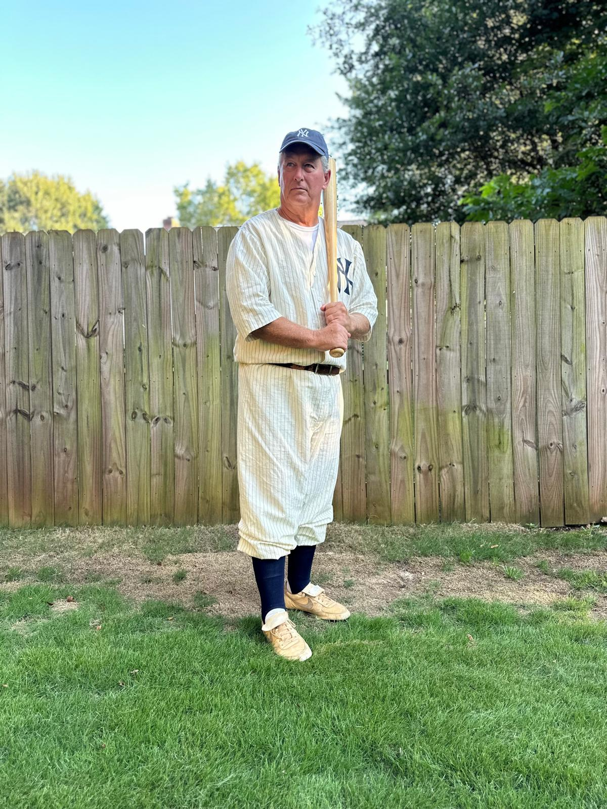 a man holding a baseball bat