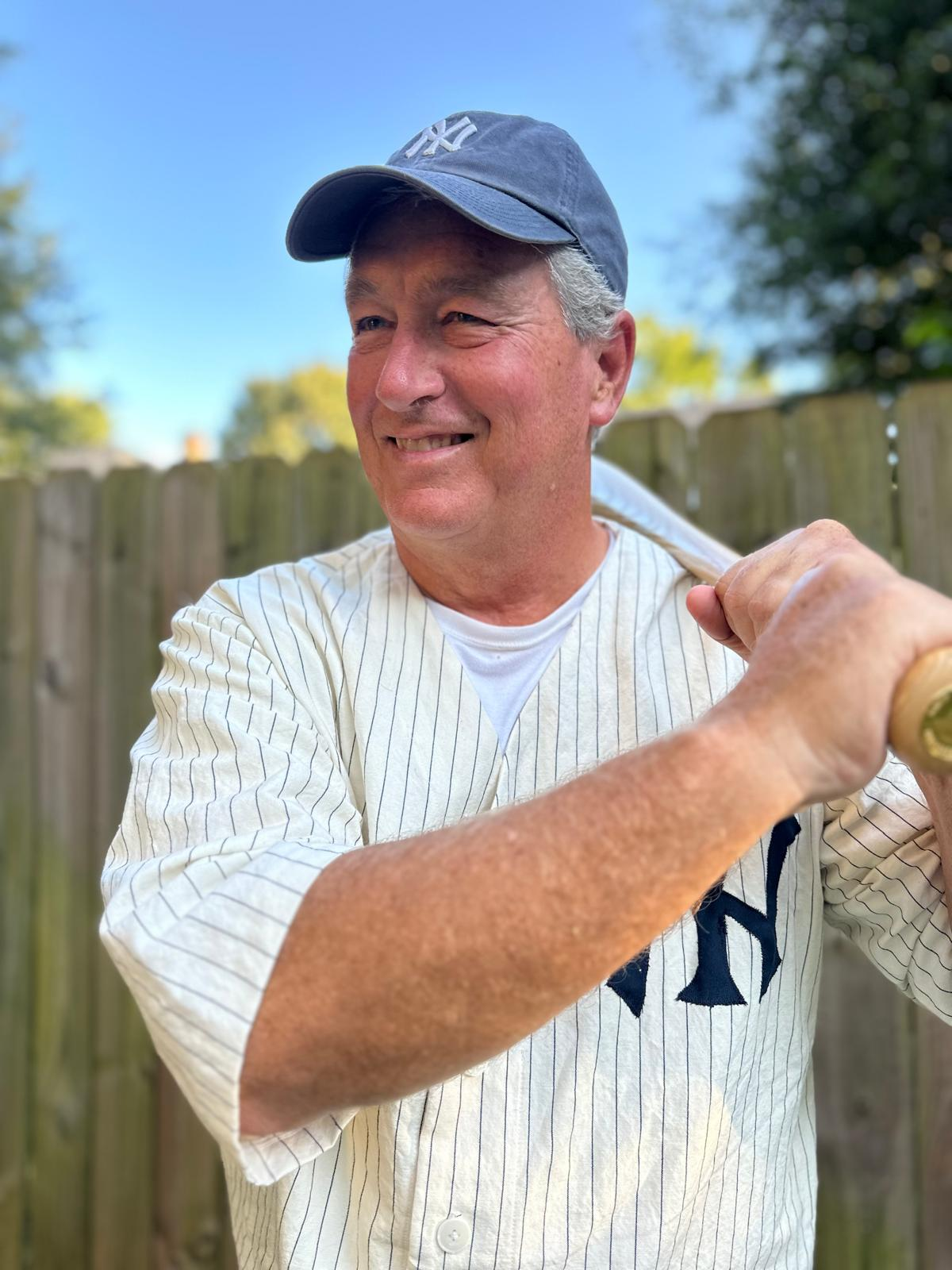 a man holding a baseball bat
