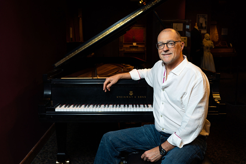 a man sitting at a piano