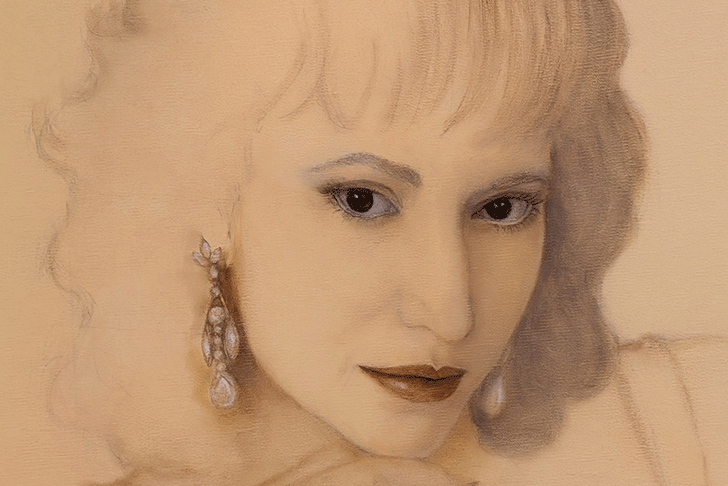 a woman with her hand on her chin