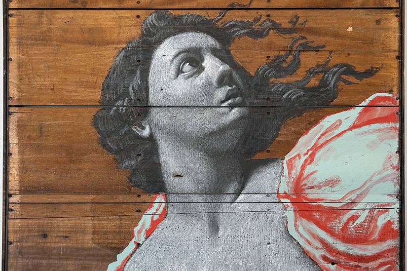 a painting of a woman on a wood surface