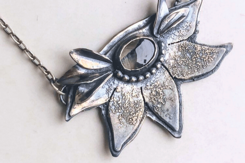 a necklace with a flower design