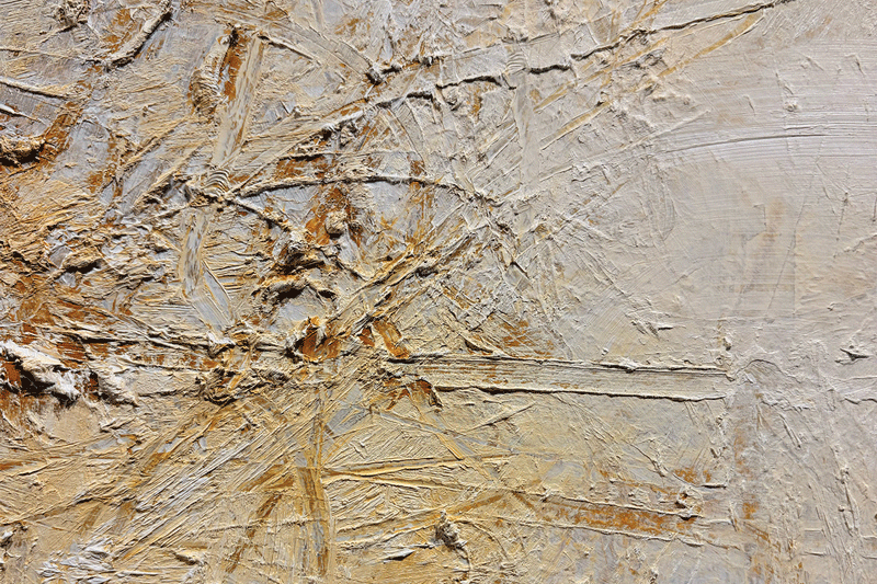 a white and brown surface with scratches