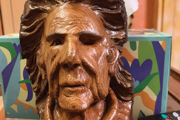 a wood carving of a man