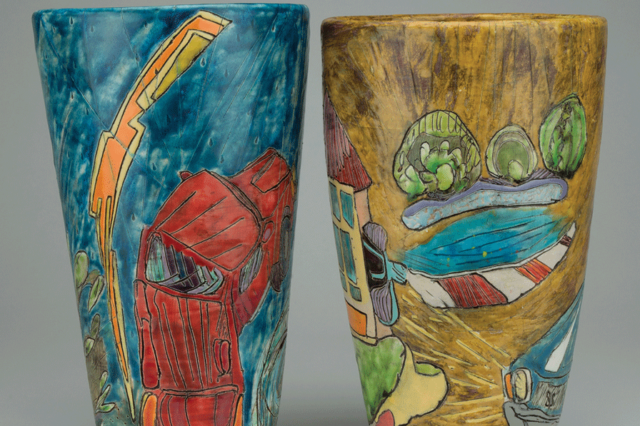 a pair of painted cups