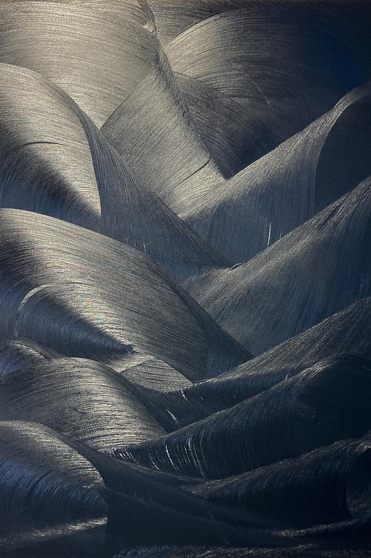 a close up of a black surface