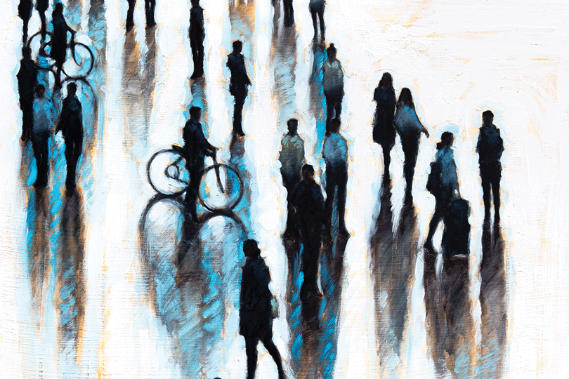 a group of people walking on a street