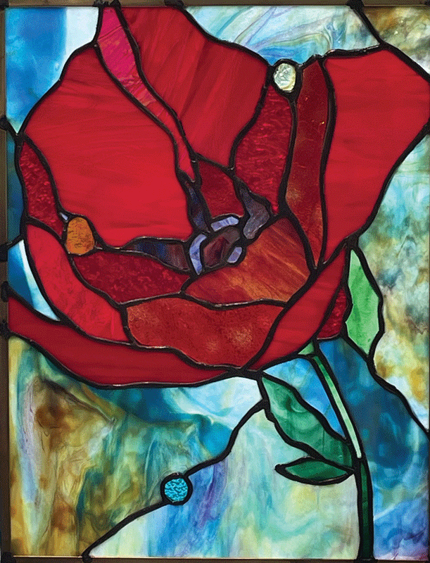 a stained glass window with a red flower