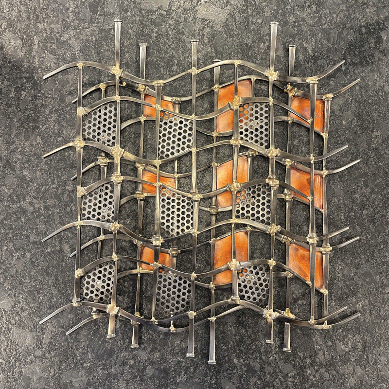 a metal grid with holes and a metal surface