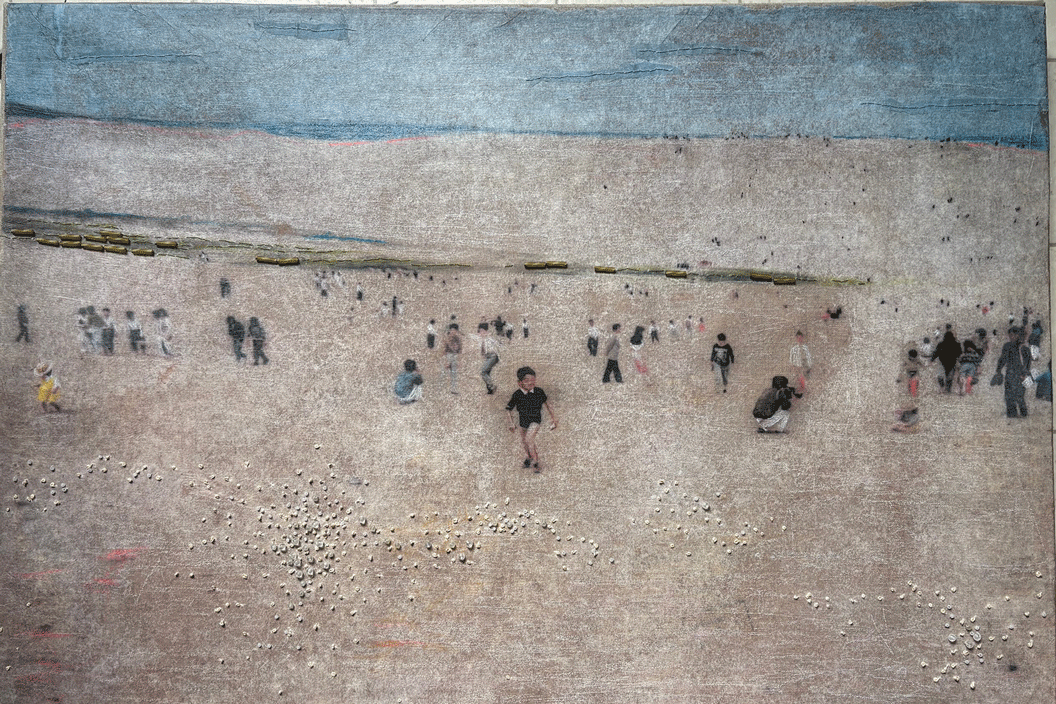 a group of people on a beach