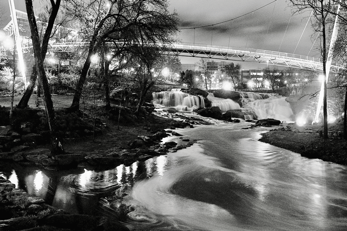 a river with a bridge and a bridge