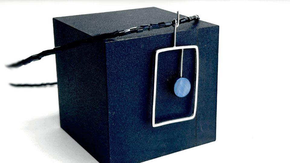 a black box with a blue object on it