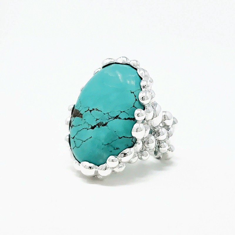 a ring with a blue stone