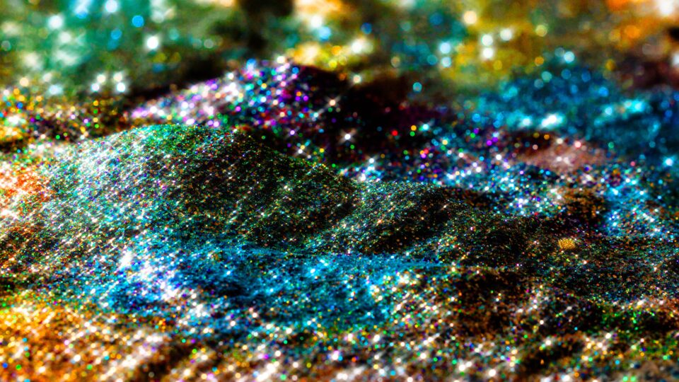 a colorful glitter on a surface