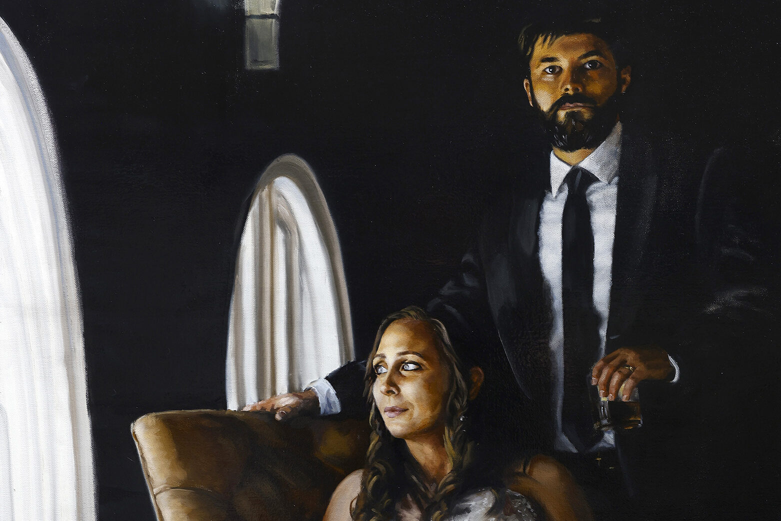 a man and woman sitting in a chair