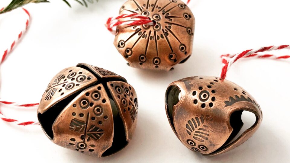 Three decorative copper jingle bells
