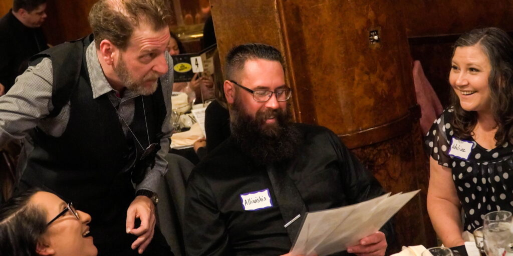 Guests engaged in a mystery dinner.