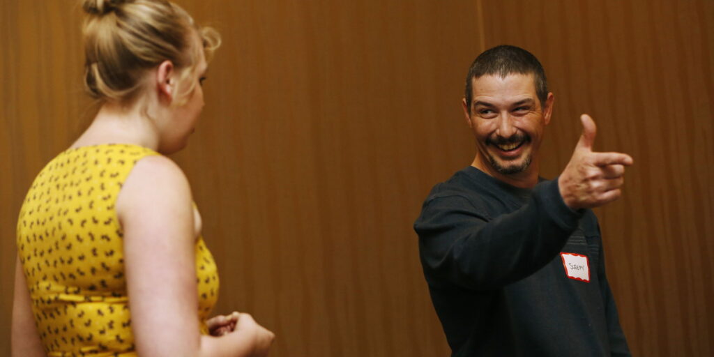 Two people engaged in conversation.